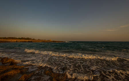 Adriatic sea. Ostuni, Puglia. Sunrise. Renowned seaside resort located in the heart of Salento. This stretch of coast is punctuated by a series of rocky beachesの写真素材