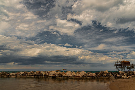 At the foot of the ancient village of Termoli, the Promenade of the Trabucchi winds its way, a portion of the coast from which you have access to the various trabucchi, or fishing machines that date back to the nineteenth century.の写真素材