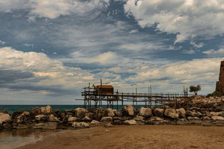 At the foot of the ancient village of Termoli, the Promenade of the Trabucchi winds its way, a portion of the coast from which you have access to the various trabucchi, or fishing machines that date back to the nineteenth century.の写真素材