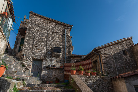 Pesche, village in the province of Isernia, in Molise, perched along the steep slopes of Mount San Marco, a white spot against the green of the mountain and the gray of the stones.の写真素材