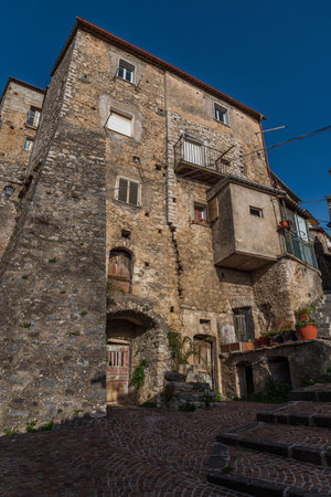 Pesche, village in the province of Isernia, in Molise, perched along the steep slopes of Mount San Marco, a white spot against the green of the mountain and the gray of the stones.の写真素材
