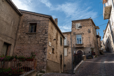Pesche, village in the province of Isernia, in Molise, perched along the steep slopes of Mount San Marco, a white spot against the green of the mountain and the gray of the stones.の写真素材