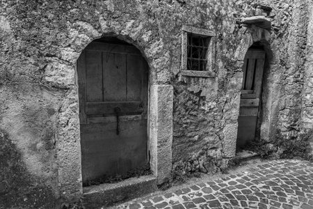 Pesche, village in the province of Isernia, in Molise, perched along the steep slopes of Mount San Marco, a white spot against the green of the mountain and the gray of the stones.の写真素材
