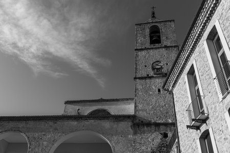 Pesche, village in the province of Isernia, in Molise, perched along the steep slopes of Mount San Marco, a white spot against the green of the mountain and the gray of the stones.の写真素材