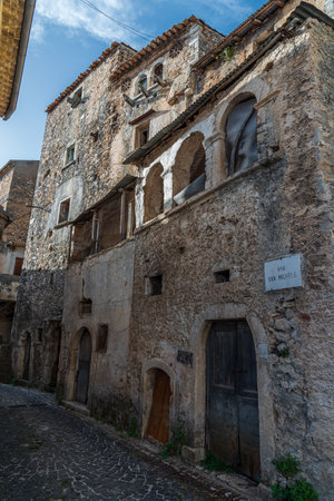 Pesche, village in the province of Isernia, in Molise, perched along the steep slopes of Mount San Marco, a white spot against the green of the mountain and the gray of the stones.の写真素材