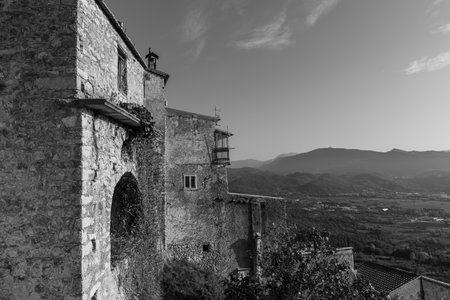 Pesche, village in the province of Isernia, in Molise, perched along the steep slopes of Mount San Marco, a white spot against the green of the mountain and the gray of the stones.の写真素材