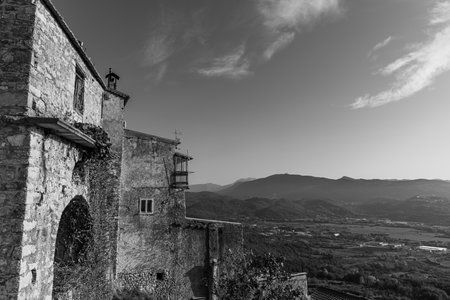 Pesche, village in the province of Isernia, in Molise, perched along the steep slopes of Mount San Marco, a white spot against the green of the mountain and the gray of the stones.の写真素材