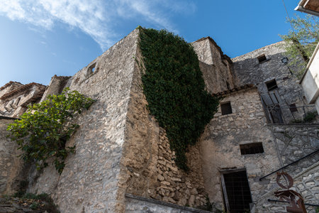 Pesche, village in the province of Isernia, in Molise, perched along the steep slopes of Mount San Marco, a white spot against the green of the mountain and the gray of the stones.の写真素材