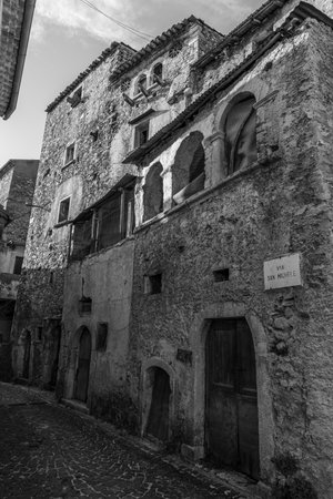 Pesche, village in the province of Isernia, in Molise, perched along the steep slopes of Mount San Marco, a white spot against the green of the mountain and the gray of the stones.の写真素材