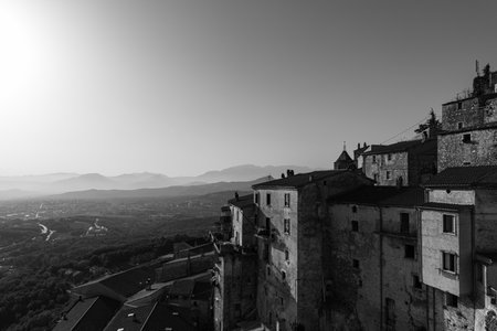 Pesche, village in the province of Isernia, in Molise, perched along the steep slopes of Mount San Marco, a white spot against the green of the mountain and the gray of the stones.の写真素材
