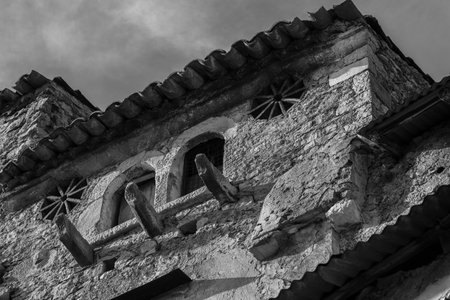 Pesche, village in the province of Isernia, in Molise, perched along the steep slopes of Mount San Marco, a white spot against the green of the mountain and the gray of the stones.の写真素材