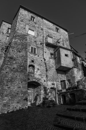 Pesche, village in the province of Isernia, in Molise, perched along the steep slopes of Mount San Marco, a white spot against the green of the mountain and the gray of the stones.の写真素材
