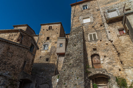 Pesche, village in the province of Isernia, in Molise, perched along the steep slopes of Mount San Marco, a white spot against the green of the mountain and the gray of the stones.の写真素材