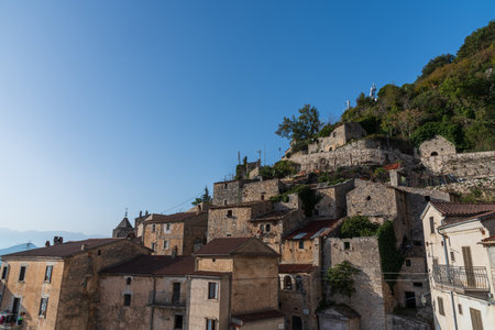 Pesche, village in the province of Isernia, in Molise, perched along the steep slopes of Mount San Marco, a white spot against the green of the mountain and the gray of the stones.の写真素材