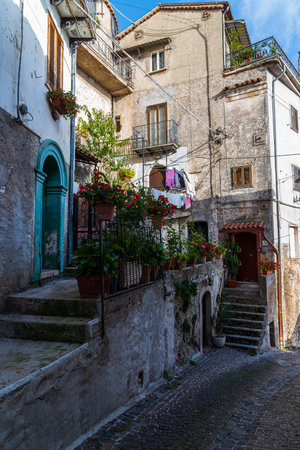 Pesche, village in the province of Isernia, in Molise, perched along the steep slopes of Mount San Marco, a white spot against the green of the mountain and the gray of the stones.の写真素材