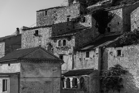 Pesche, village in the province of Isernia, in Molise, perched along the steep slopes of Mount San Marco, a white spot against the green of the mountain and the gray of the stones.の写真素材