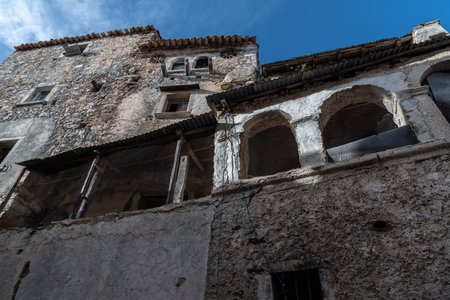 Pesche, village in the province of Isernia, in Molise, perched along the steep slopes of Mount San Marco, a white spot against the green of the mountain and the gray of the stones.の写真素材
