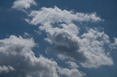 Clouds in the sky. The wonderful spectacle of a sky full of clouds. Depth and three-dimensionality of a cloudy sky.の写真素材