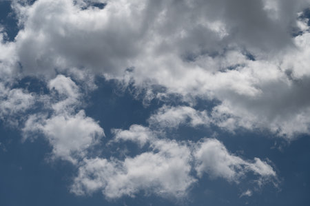 Clouds in the sky. The wonderful spectacle of a sky full of clouds. Depth and three-dimensionality of a cloudy sky.の写真素材