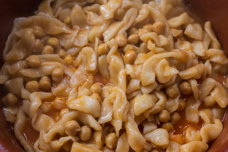 Typical dish from Campania, the "Pettule e ciceri" are nothing more than pasta made with flour, water, salt and a little oil. Tradition is at home.の写真素材