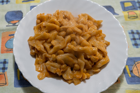 Typical dish from Campania, the "Pettule e ciceri" are nothing more than pasta made with flour, water, salt and a little oil. Tradition is at home.の写真素材