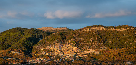 Pesche, village in the province of Isernia, in Molise, perched along the steep slopes of Mount San Marco, a white spot against the green of the mountain and the gray of the stones.の写真素材