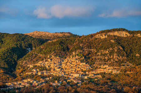Pesche, village in the province of Isernia, in Molise, perched along the steep slopes of Mount San Marco, a white spot against the green of the mountain and the gray of the stones.の写真素材