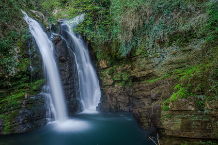 In the heart of a very small village in Molise, immersed in an enchanted forest and floral nature, stands the Carpinone waterfall, one of the most fascinating spectacles of the local nature.の写真素材