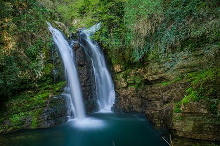 In the heart of a very small village in Molise, immersed in an enchanted forest and floral nature, stands the Carpinone waterfall, one of the most fascinating spectacles of the local nature.の写真素材
