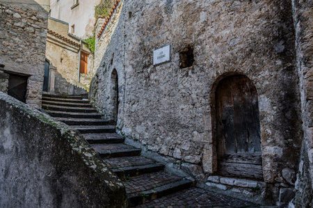 Pesche, village in the province of Isernia, in Molise, perched along the steep slopes of Mount San Marco, a white spot against the green of the mountain and the gray of the stones.の写真素材