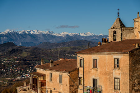 Pesche, village in the province of Isernia, in Molise, perched along the steep slopes of Mount San Marco, a white spot against the green of the mountain and the gray of the stones.の写真素材