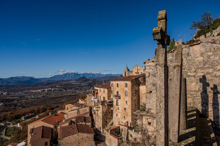 Pesche, village in the province of Isernia, in Molise, perched along the steep slopes of Mount San Marco, a white spot against the green of the mountain and the gray of the stones.の写真素材