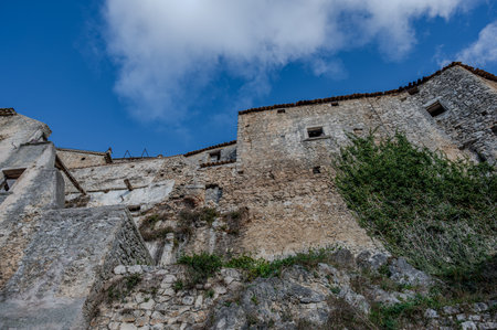 Pesche, village in the province of Isernia, in Molise, perched along the steep slopes of Mount San Marco, a white spot against the green of the mountain and the gray of the stones.の写真素材