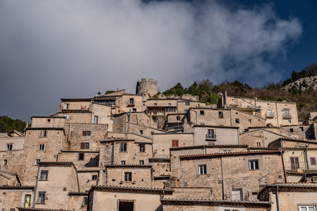 Pesche, village in the province of Isernia, in Molise, perched along the steep slopes of Mount San Marco, a white spot against the green of the mountain and the gray of the stones.の写真素材