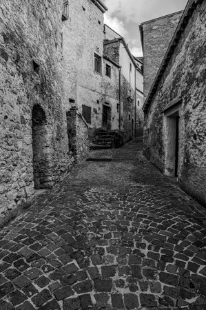 Pesche, village in the province of Isernia, in Molise, perched along the steep slopes of Mount San Marco, a white spot against the green of the mountain and the gray of the stones.の写真素材