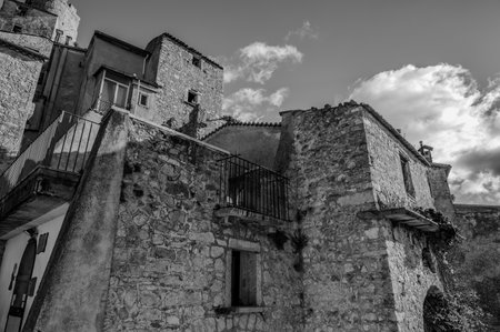 Pesche, village in the province of Isernia, in Molise, perched along the steep slopes of Mount San Marco, a white spot against the green of the mountain and the gray of the stones.の写真素材