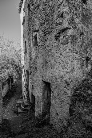 Pesche, village in the province of Isernia, in Molise, perched along the steep slopes of Mount San Marco, a white spot against the green of the mountain and the gray of the stones.の写真素材