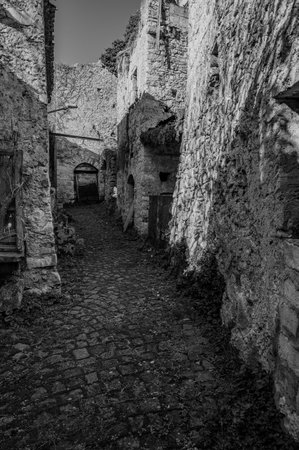 Pesche, village in the province of Isernia, in Molise, perched along the steep slopes of Mount San Marco, a white spot against the green of the mountain and the gray of the stones.の写真素材