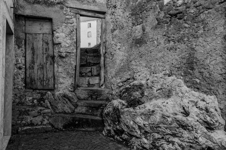 Pesche, village in the province of Isernia, in Molise, perched along the steep slopes of Mount San Marco, a white spot against the green of the mountain and the gray of the stones.の写真素材