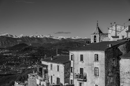 Pesche, village in the province of Isernia, in Molise, perched along the steep slopes of Mount San Marco, a white spot against the green of the mountain and the gray of the stones.の写真素材