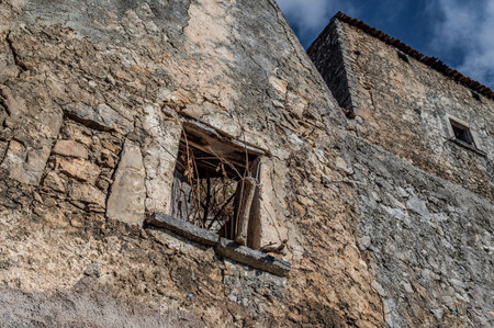 Pesche, village in the province of Isernia, in Molise, perched along the steep slopes of Mount San Marco, a white spot against the green of the mountain and the gray of the stones.の写真素材