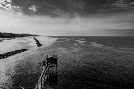 At the foot of the ancient village of Termoli, the Passeggiata dei Trabucchi winds its way, a stretch of coast from which it is possible to access the trabucchi, ancient fishing machines.の写真素材