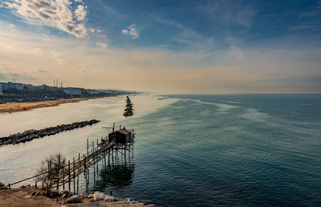 At the foot of the ancient village of Termoli, the Passeggiata dei Trabucchi winds its way, a stretch of coast from which it is possible to access the trabucchi, ancient fishing machines.の写真素材