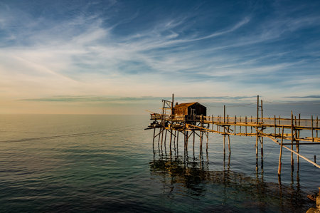 At the foot of the ancient village of Termoli, the Passeggiata dei Trabucchi winds its way, a stretch of coast from which it is possible to access the trabucchi, ancient fishing machines.の写真素材