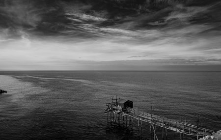 At the foot of the ancient village of Termoli, the Passeggiata dei Trabucchi winds its way, a stretch of coast from which it is possible to access the trabucchi, ancient fishing machines.の写真素材