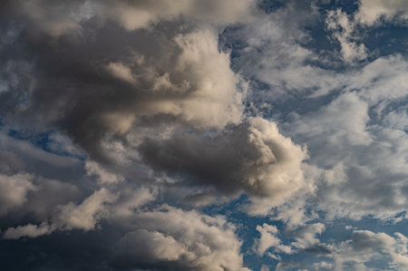 Clouds in the sky. The wonderful spectacle of a sky full of clouds. Depth and three-dimensionality of a cloudy sky.の写真素材