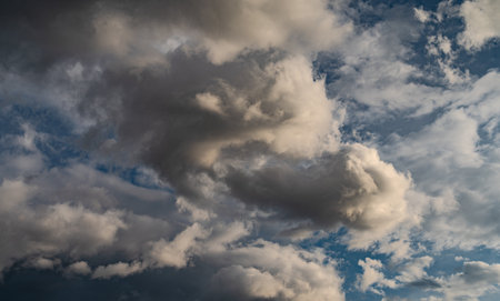 Clouds in the sky. The wonderful spectacle of a sky full of clouds. Depth and three-dimensionality of a cloudy sky.の写真素材