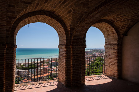 It rises on the shores of the Adriatic Sea and is located north of the mouth of the Tesino River. The town extends along the coast to the slopes of the surrounding hills.の写真素材