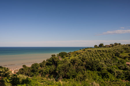 The Marche, a region of eastern Italy, rises between the Apennine mountains and the Adriatic Sea.