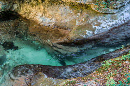 Over millions of years, the Orfento River (in the municipality of Caramanico Terme) has carved out a narrow gorge now covered by dense riparian vegetation featuring willows, ferns, and mosses.の写真素材